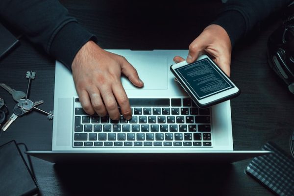 close-up-programmer-hacker-hands-typing-code_93675-112732