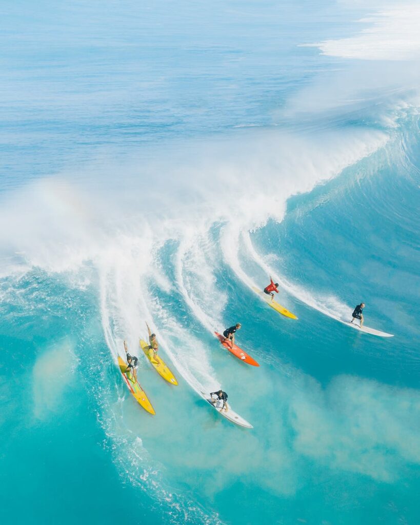 people surfing on sea waves